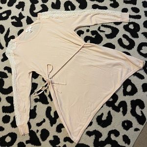 Long sleeve Womens Maternity shirt. This shirt is a cream/light pink shirt.